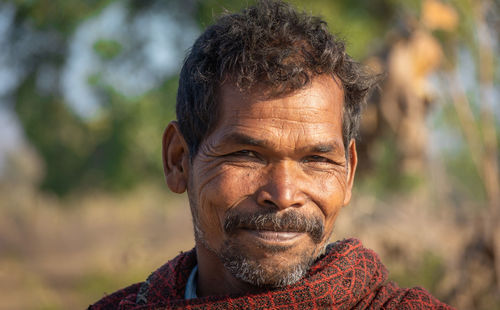 Portrait of man smiling outdoors