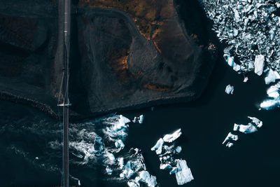 High angle view of icebergs in sea