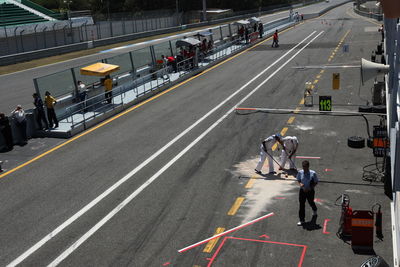 High angle view of people walking on road