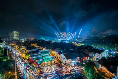 High angle view of illuminated buildings in city at night