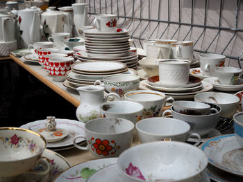 High angle view of utensils for sale on table in flea market