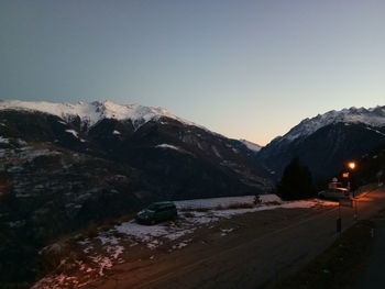 Scenic view of snowcapped mountains against clear sky