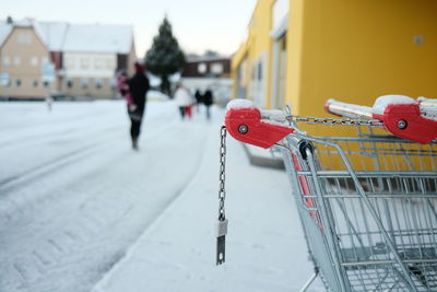 Close-up of shopping cart on snow