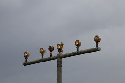 Low angle view of airport light against sky