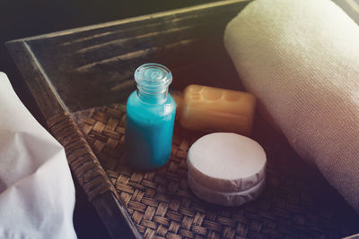 High angle view of bottles in drawer