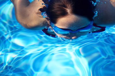 Portrait of woman swimming in pool