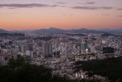 High angle view of cityscape against sky during sunset