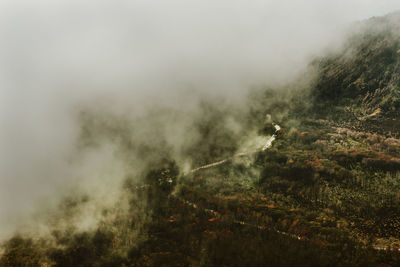 Smoke emitting from volcanic mountain