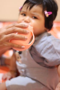 Portrait of a boy drinking water