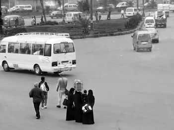 People standing on road in city