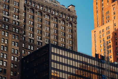 Low angle view of buildings against clear sky