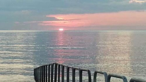Scenic view of sea at sunset