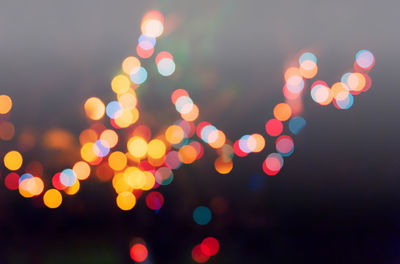 Defocused image of illuminated lights at night