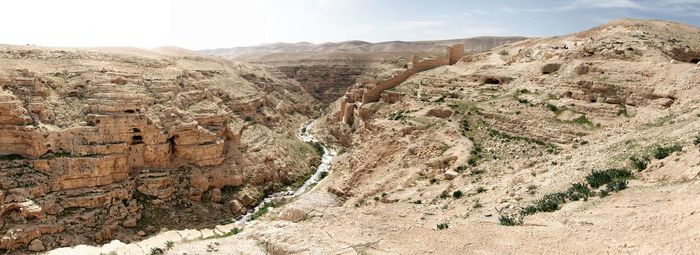 View of desert against mountain range