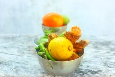 Close-up of fruits in bowl on table