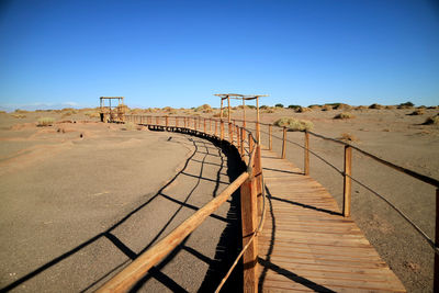 Wooden walkway in the archaeological site of tulor, atacama desert , northern chile