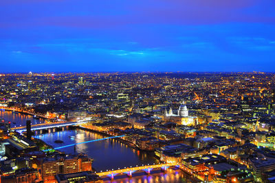 High angle view of illuminated cityscape at night