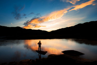 Landscape silhouette the mountains, the sunset in the evening sky,