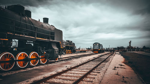 Train on railroad tracks against sky