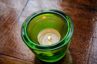 High angle view of green tea cup on table