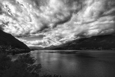 Scenic view of lake and mountains against sky