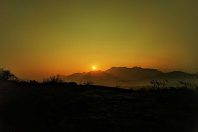 Scenic view of silhouette landscape against sky during sunset