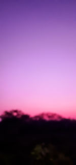 Scenic view of silhouette landscape against romantic sky at sunset