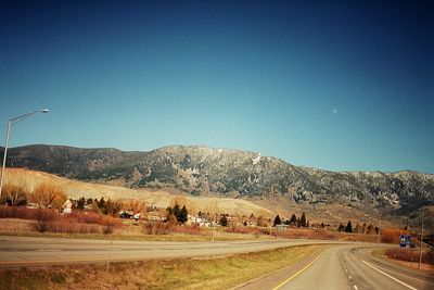 Country road leading towards mountains