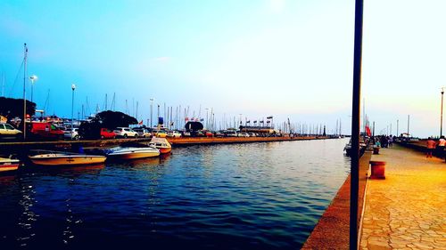 Boats moored at harbor