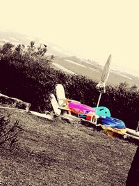 Close-up of toy on beach against sky