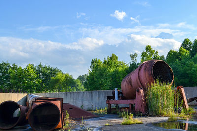 Storage tank against sky