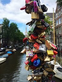 Close-up of padlocks on bridge over river