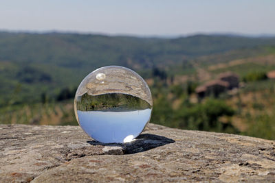 The tuscan countryside reflected in a crystal ball