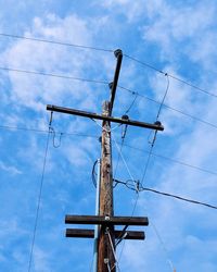 Low angle view of communications tower against sky