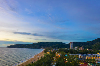 High angle view of sea and buildings against sky