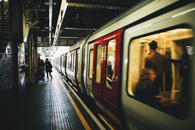 Man in train at railroad station