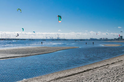 Scenic view of beach against blue sky