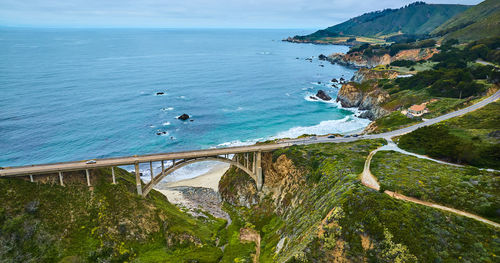 High angle view of sea against mountain