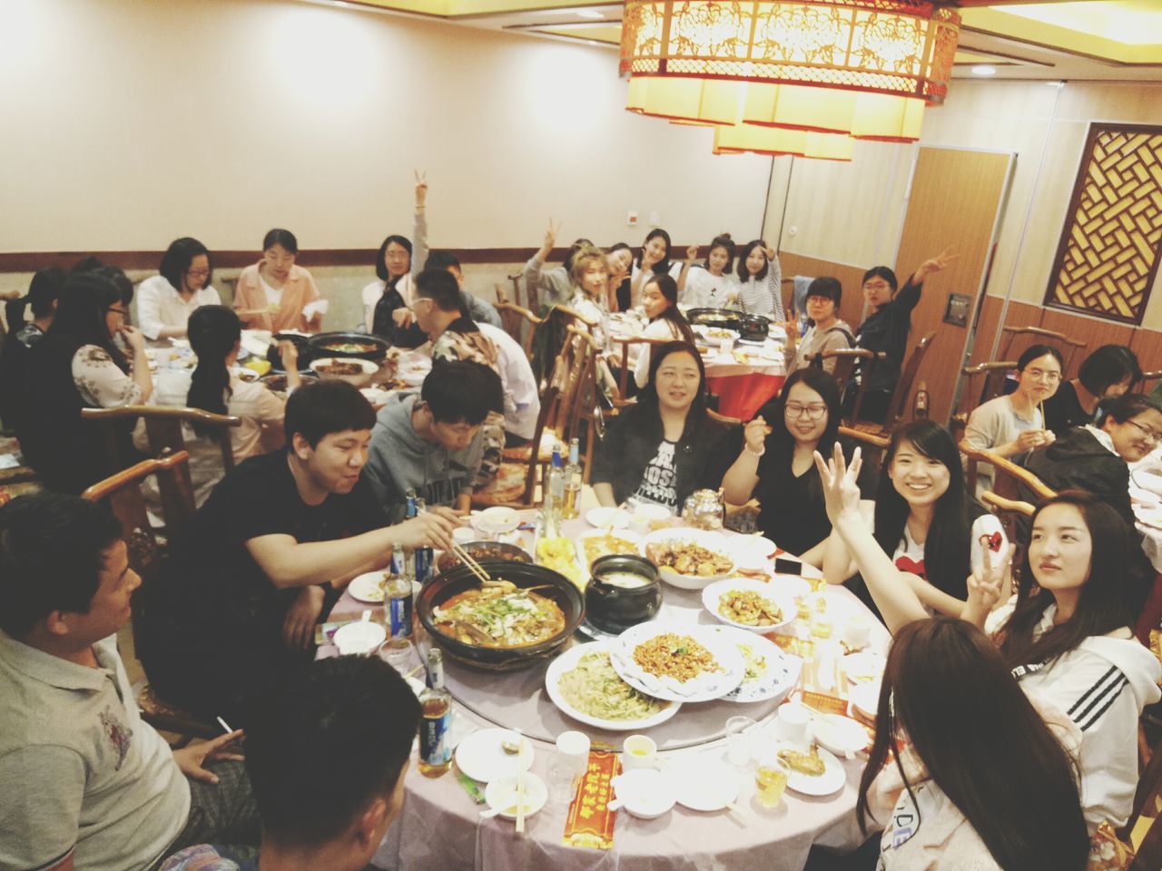large group of people, real people, food and drink, togetherness, food, indoors, celebration, sitting, lifestyles, table, women, plate, eating, happiness, friendship, boys, architecture, freshness, day, ready-to-eat, bride, people
