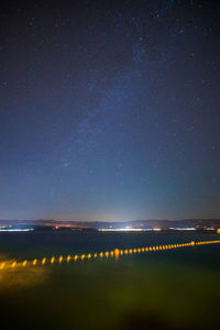 Illuminated road at night