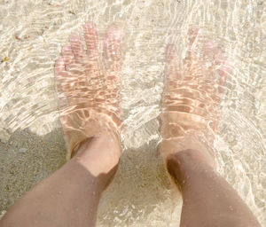 Low section of people standing in water