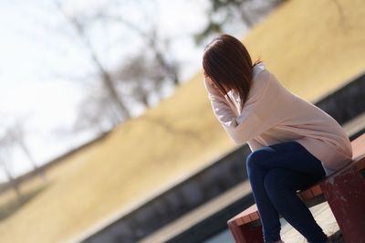 Midsection of woman against sky