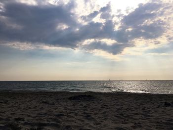 Scenic view of sea against cloudy sky