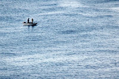 People fishing in sea