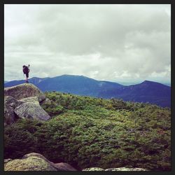 Scenic view of landscape against cloudy sky