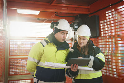 Engineers talking at building site