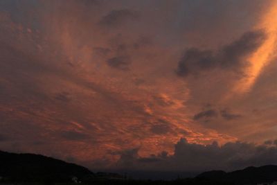 Low angle view of dramatic sky during sunset