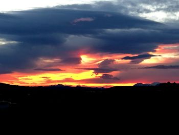 Scenic view of dramatic sky during sunset