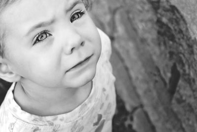 Close-up portrait of cute girl looking away