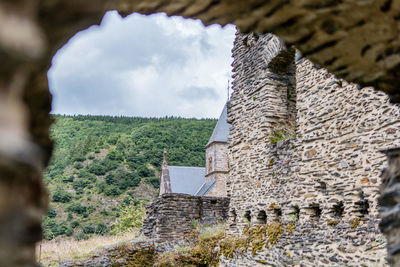 Close-up of old building against sky